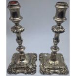 A pair of 19th century silver candlesticks, filled bases, 924g, H.23cm