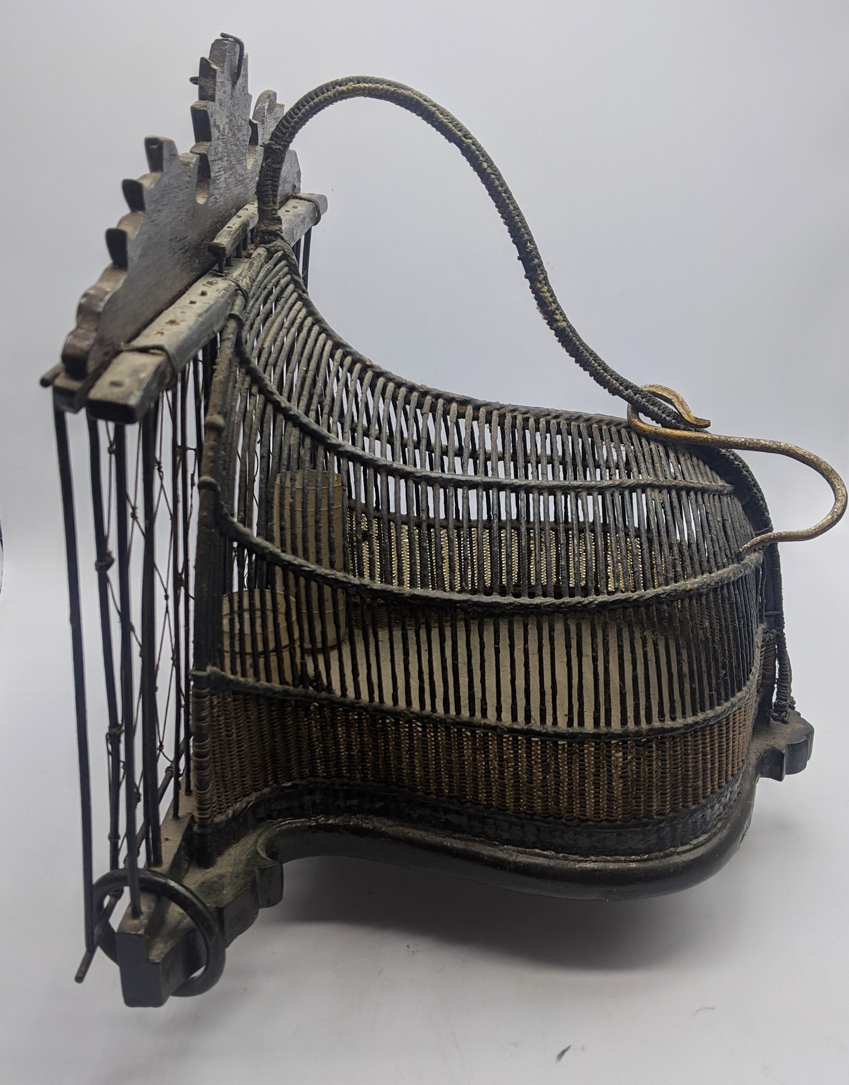 A Malay Quail trap (Jebak Puyuh) with carved wood and metal cage, Malay People, Malaysia or Southern