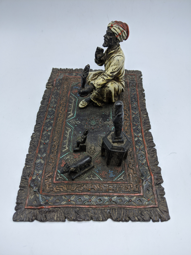 Franz Bergman, study of an Arab on a carpet selling Shabti's, Austrian cold painted bronze, stamps - Image 3 of 4