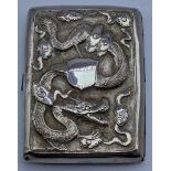 A Chinese silver cigarette case, decorated with a stylised dragon to front, lotus tree to reverse,