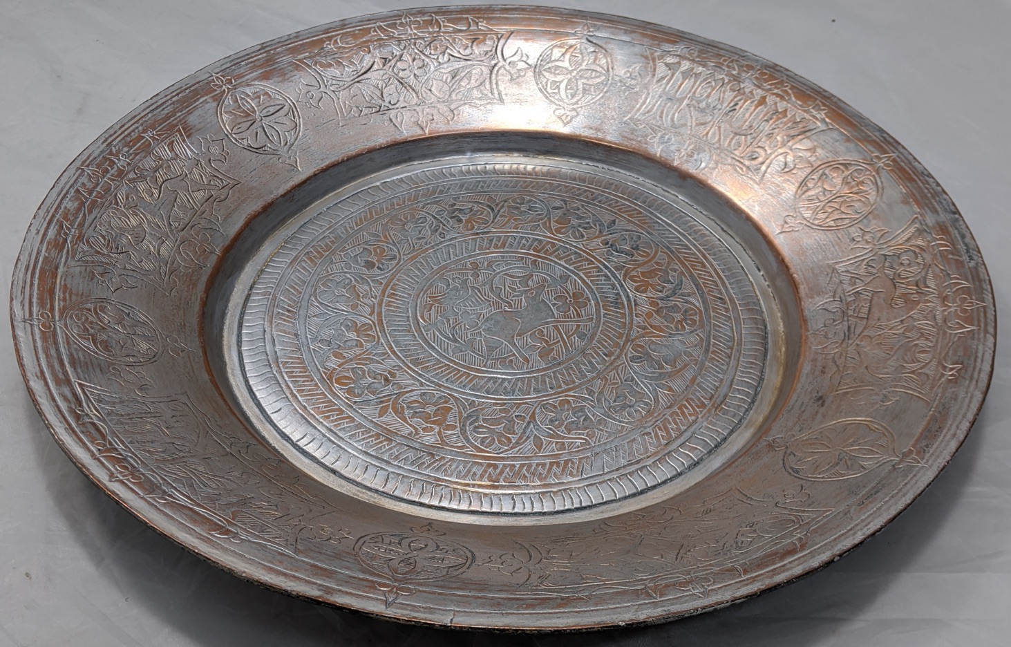 An early 20th century Persian silvered copper bowl, etched with scrolling patterns and animals, D. - Image 3 of 3