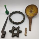A group of bronze and terracotta objects, including a bayonet, a crown, a star-shaped ring, a