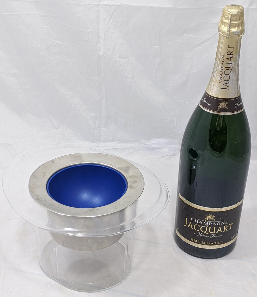 A Champagne display bottle H.50cm together with a bottle cooler in the form of a top hat