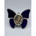 A late Victorian silver and enamel butterfly photo frame, hallmarked London, maker Henry Stuart