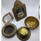 A collection of Middle Eastern items to include mirrors, bowls and an anklet dish