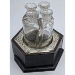 An Edwardian hexagonal wooden holder mounted with silver with integrated glass scent bottles, vacant