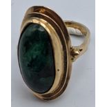 A yellow gold ring mounted with malachite stone, indistinct marks to band, 3.5g, size I,