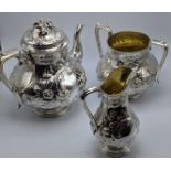 A Victorian three piece silver tea set, vacant cartouches, hallmarked Birmingham, 1863-64, maker