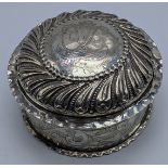 A Continental silver round box, etched stylised designs, repousse embossed lid, 109g, H.5cm D.9.5cm