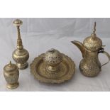 A collection of Middle Eastern brass items to include a teapot, rose water sprinkler etc.