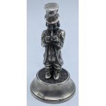 A Spanish silver figure in a top hat playing a flute, 77.3g, H.10cm