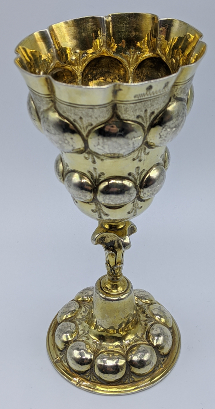 A German Augsburg 17th century gilt silver goblet, H.16.5cm