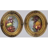 A pair of 19th century English porcelain oval plaques, painted with fruit and hydrangea, mounted