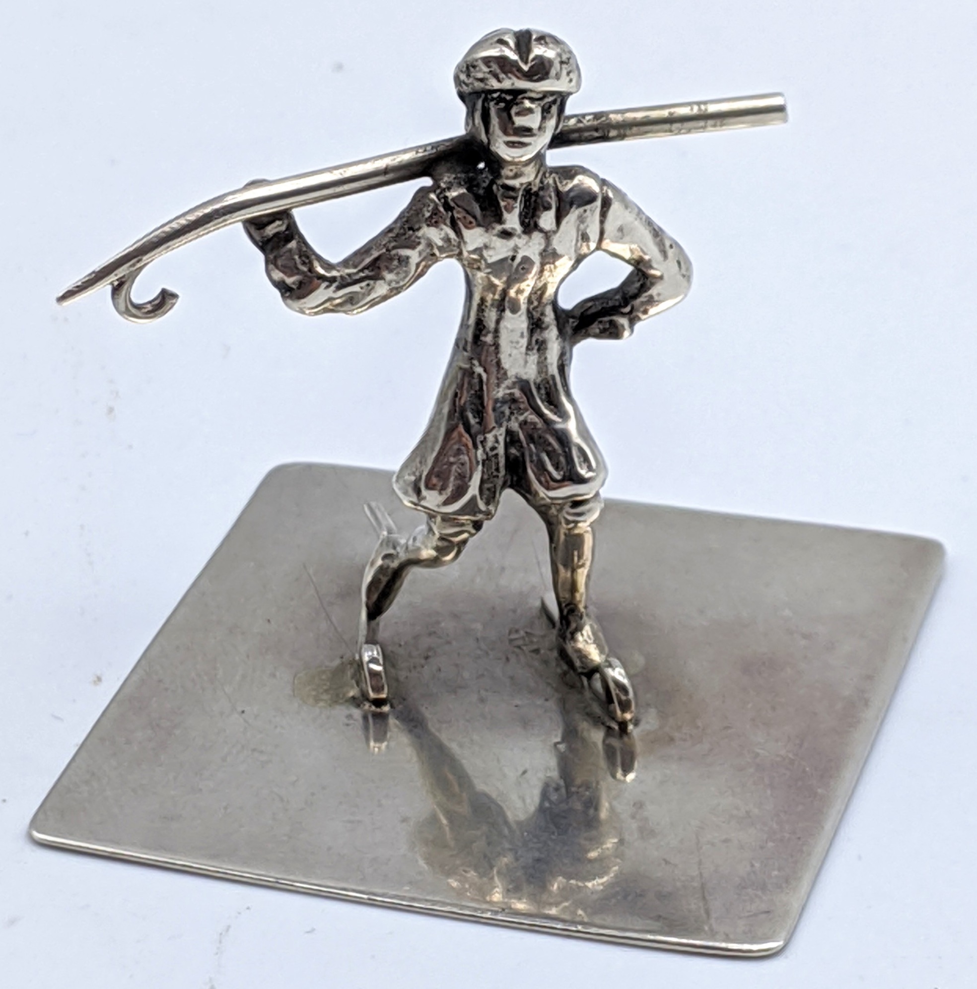 A Russian silver study of a skater, marks to base, H.3cm