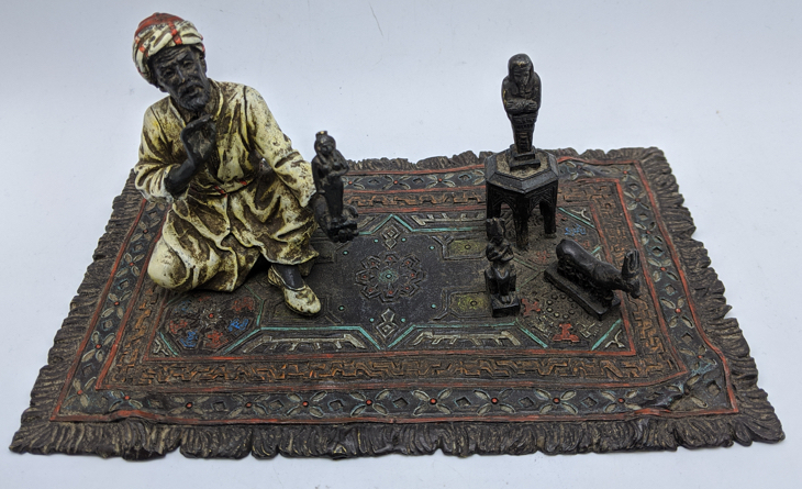 Franz Bergman, study of an Arab on a carpet selling Shabti's, Austrian cold painted bronze, stamps