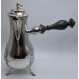 A French early 19th century silver coffee pot, wooded handle, acorn form finial, 765g, H.27cm