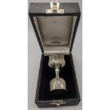 An Indian silver double spirit measure with embossed floral and foliate decoration in original case,