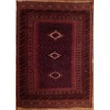 An Afghan red ground rug, 210cm x 143cm