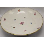 A 19th century Meissen bowl, floral design with gold coloured rim, D.26.5cm