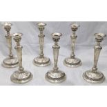 A set of six George III silver candlesticks, crest to base and to removable turrets, hallmarked