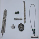A collection of silver jewellery to include two Macintosh style brooches, a necklace, two bracelets,