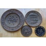 A collection of four Victorian wall hanging chargers and plates, largest being 57 cm.