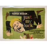 A vintage film poster, The Rank Organisation Presents Norman Wisdom in Just My Luck, also