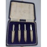 A set of 4 silver corn on the cob holders, cased, hallmarked Birmingham, 1973, maker J B