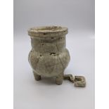 A Chinese celadon crackle glazed pot, H.12cm (A/F)