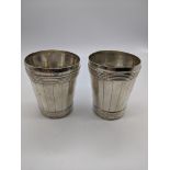 A Georgian double barrel silver beaker, engraving to the base of one, maker SW, 285g, H.9cm