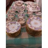 A Coalport tea set and cabinet plates