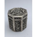 A Chinese silver octagonal box, decorated with auspicious mythical creatures, dragon and phoenix,