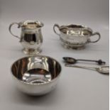 A collection of silver to include to include a twin handled quaich with Celtic style banding, W.15cm