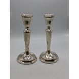 A pair of late 19th century Mappin & Webb silver candlesticks, hallmarked Birmingham, 1987, filled