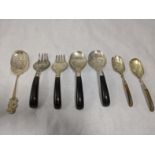 A collection of Malaysian silver cutlery to include, one of the large forks and spoons with the