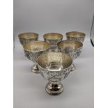 A set of 6 Jewish silver goblet depicting the Star of David, a menorah, grapes and a band of