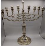 A large early 20th century silver menorah, hallmarked London 1921, maker Joseph Zweig, filled