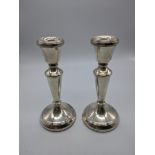 A pair of late 20th century silver candlesticks by L.J.Millington, hallmarked Birminghmam, filled