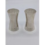 A pair of Georg Jenson silver peppers, import sterling hallmarks, 122g, H.6.5cm