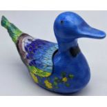 A Korean silver cloisonne enamel container in the form of a duck, the plumage lifts to expose