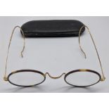 A pair of 19th century spectacles in tortoise shell and gold, original case