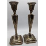 A pair of early 20th century silver candlesticks, hallmarked Chester, 1926-27, maker C&S, filled