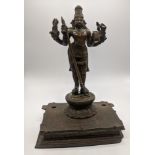 An Indian Hindu bronze of Virabhadra raised on stand, H.26cm