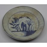 An early 19th Century Chinese export white plate having blue flora decoration, bearing character