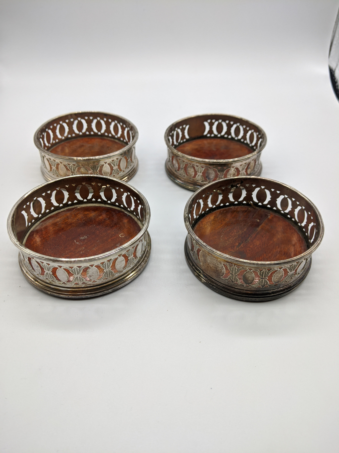 A set of four 19th century silver plated coasters, D.8.5cm