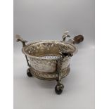 A Queen Anne silver brazier, pierced central design, claw and ball feet, turned wooden handle,