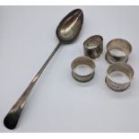 A George III basting spoon, L.30cm, together with 4 silver napkin rings, 225g