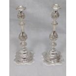 A pair of silver Sabbath candlesticks, repousse embossed, hallmarked London, 1911, 1001g, H.38cm