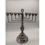 An early 20th century silver menorah, octagonal base, Star of David finial, hallmarked London 1930-