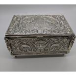 A late 19th century silver box by Thomas Glaser, decorated with cherubs, flora and fauna and other